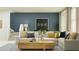 Living room boasts a stylish sofa, modern decor, and neutral colors providing a relaxing atmosphere at 3477 Lapis Lake Dr, Zephyrhills, FL 33541