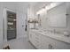 Bright bathroom with double vanity, decorative tiling, and lots of storage at 3543 Gamble St, New Port Richey, FL 34655