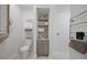 Bright bathroom featuring white subway tile in shower, decorative floor tile, and built in shelving and storage at 3543 Gamble St, New Port Richey, FL 34655