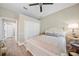 Bedroom features a white bed frame, light wood floors, and neutral paint at 3543 Gamble St, New Port Richey, FL 34655