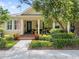 Charming home featuring a cozy front porch, lovely landscaping, and manicured lawn at 3543 Gamble St, New Port Richey, FL 34655