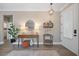 Stylish foyer featuring wood-look flooring, decorative console table, and modern lighting at 3543 Gamble St, New Port Richey, FL 34655