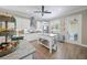 Kitchen with white cabinets, stainless steel appliances and an island with counter seating at 3543 Gamble St, New Port Richey, FL 34655