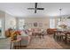 Bright living room with lots of natural light, neutral tones, and a large patterned rug at 3543 Gamble St, New Port Richey, FL 34655