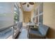 Enclosed patio featuring tile floors, wicker furniture, and sun shades at 3543 Gamble St, New Port Richey, FL 34655
