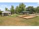 Community playground featuring a swing set, covered picnic pavilion, and lush green space for outdoor activities at 3543 Gamble St, New Port Richey, FL 34655