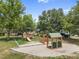 Well-maintained community playground offering a slide, climbing structures, and a sand play area for enjoyment at 3543 Gamble St, New Port Richey, FL 34655