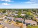 This aerial view showcases the residential community, featuring manicured lawns and tree coverage at 3621 Beacon Square Dr, Holiday, FL 34691