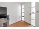 Foyer with hardwood floors, side windows and front door at 3621 Beacon Square Dr, Holiday, FL 34691