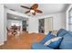 View of living room leading to the kitchen and dining area at 3621 Beacon Square Dr, Holiday, FL 34691