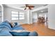 Comfortable living room featuring wood-look flooring and a ceiling fan at 3621 Beacon Square Dr, Holiday, FL 34691