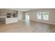 Open-concept living area with modern finishes and natural light at 37114 Sagemoor Dr, Zephyrhills, FL 33541
