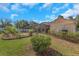Spacious backyard featuring a screened pool enclosure, patio, and lush landscaping at 3908 Lithia Ridge Blvd, Valrico, FL 33596