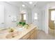 Well lit bathroom featuring double sinks, large mirror and tile flooring at 3908 Lithia Ridge Blvd, Valrico, FL 33596