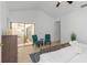 Bright bedroom featuring tiled floors, vaulted ceilings, and seating area with view to outdoor area at 3908 Lithia Ridge Blvd, Valrico, FL 33596