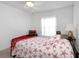 Bright bedroom featuring a starfish quilt and matching pillows at 3908 Lithia Ridge Blvd, Valrico, FL 33596
