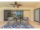 Relaxing lanai with seating, ceiling fan, and view of the lush garden at 3908 Lithia Ridge Blvd, Valrico, FL 33596