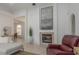 Cozy living room with fireplace, natural light, and seamless flow to dining area at 3908 Lithia Ridge Blvd, Valrico, FL 33596