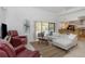 Bright living room with views of the pool and access to the kitchen at 3908 Lithia Ridge Blvd, Valrico, FL 33596