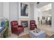 Inviting living space with a fireplace, stylish decor, and comfortable chairs for relaxing at 3908 Lithia Ridge Blvd, Valrico, FL 33596
