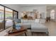 Open-concept living room with access to kitchen and views of the pool at 3908 Lithia Ridge Blvd, Valrico, FL 33596