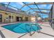 Sparkling pool area with covered lanai, bar seating, and ample room for entertaining at 3908 Lithia Ridge Blvd, Valrico, FL 33596