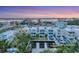Stunning aerial view showcasing waterfront homes in a vibrant coastal neighborhood at dusk at 4357 Marina View Way, Cortez, FL 34215
