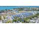 Expansive aerial view highlighting waterfront homes in a vibrant coastal community at 4357 Marina View Way, Cortez, FL 34215