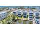 Aerial view of homes with balconies and water access in a coastal community at 4357 Marina View Way, Cortez, FL 34215