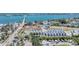 Aerial view of coastal real estate featuring modern homes with solar panels and waterfront access at 4357 Marina View Way, Cortez, FL 34215