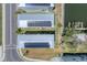 Overhead view of solar panels and waterfront docks enhancing these modern, luxurious homes at 4357 Marina View Way, Cortez, FL 34215