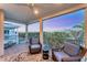 Balcony with two chairs and a table with an amazing view at 4357 Marina View Way, Cortez, FL 34215