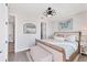 Comfortable bedroom featuring a king bed, modern butterfly wall art, and stylish decor at 4357 Marina View Way, Cortez, FL 34215