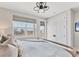 Comfortable bedroom featuring a king bed, modern ceiling fan, and views of the community at 4357 Marina View Way, Cortez, FL 34215