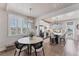 Bright, open dining area adjacent to kitchen, with white plantation shutters at 4357 Marina View Way, Cortez, FL 34215