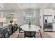 Bright dining area features stylish decor and a view of the living area and stainless fridge at 4357 Marina View Way, Cortez, FL 34215