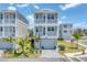 Charming three-story home with a two-car garage and a landscaped front yard at 4357 Marina View Way, Cortez, FL 34215