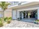 Spacious garage with organized storage, tiled floor, and an open door leading outside at 4357 Marina View Way, Cortez, FL 34215