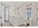 Upstairs landing with modern decorative lighting, neutral paint and decor, and beautiful floors at 4357 Marina View Way, Cortez, FL 34215