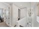 Hallway laundry area has an open door, allowing natural light into the laundry nook at 4357 Marina View Way, Cortez, FL 34215