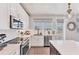Well-equipped kitchen with stainless steel appliances, ample counter space, and white cabinetry, perfect for meal preparation at 4357 Marina View Way, Cortez, FL 34215