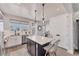 Contemporary kitchen showcases a center island, stainless steel appliances, and a stylish design for a delightful cooking experience at 4357 Marina View Way, Cortez, FL 34215