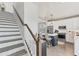 Open concept kitchen with stainless steel appliances, a center island with seating, and plenty of natural light at 4357 Marina View Way, Cortez, FL 34215