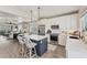 Bright modern kitchen and connecting dining area with an open concept design at 4357 Marina View Way, Cortez, FL 34215