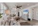 Bright living room with hardwood floors, modern furniture, and a large window with a beautiful view at 4357 Marina View Way, Cortez, FL 34215