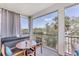 Comfortable seating on a screened porch with a scenic outdoor view at 4357 Marina View Way, Cortez, FL 34215