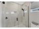 Modern shower with white tile, a window, and black hardware at 4357 Marina View Way, Cortez, FL 34215