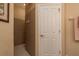 Neutral-toned bathroom featuring a tiled shower with glass doors at 4605 Casswell Dr, New Port Richey, FL 34652