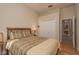 Bedroom with hard wood floors, neutral walls and a view of the doorway and closet at 4605 Casswell Dr, New Port Richey, FL 34652