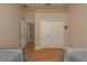 Bedroom with two twin beds with matching decor and a closet at 4605 Casswell Dr, New Port Richey, FL 34652